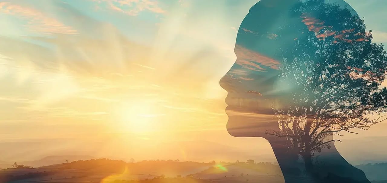 Sunset double exposure with tree and woman's profile